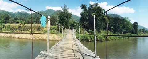 Framed Old wooden bridge across the river, Chiang Mai Province, Thailand Print