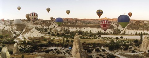 Framed Mulit colored hot air balloons at sunrise over Cappadocia, Central Anatolia Region, Turkey Print