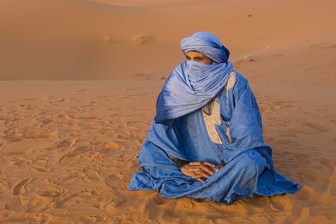 Framed Veiled Tuareg man sitting cross-legged on the sand, Erg Chebbi, Morocco Print
