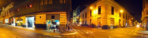 Framed Shops along a street at night, Lima, Peru Print