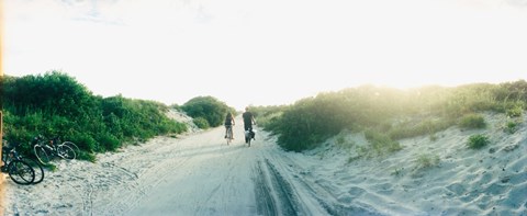 Framed Rear view of a couple cycling along a beach trail, Fort Tilden, Queens, New York City, New York State, USA Print