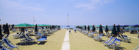 Framed Deck chairs and umbrellas on the beach, Viareggio, Tuscany, Italy Print