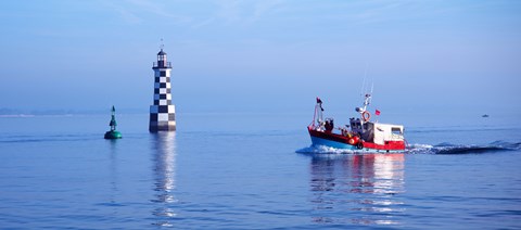 Framed Les Perdrix lighthouse and fishing boat at Loctudy, Brittany, France Print