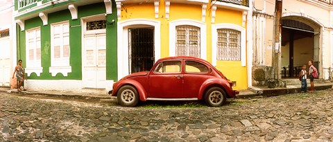 Framed Small old red car parked in front of colorful building, Pelourinho, Salvador, Bahia, Brazil Print