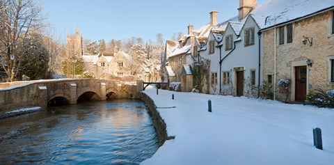 Framed Buildings along snow covered street, Castle Combe, Wiltshire, England Print