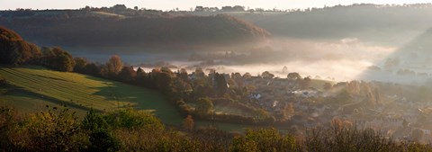 Framed Misty morning valley with village, Uley, Gloucestershire, England Print