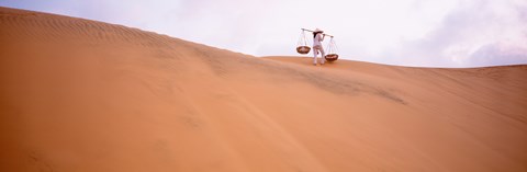 Framed Rear view of a woman carrying panniers, Mui Ne, Vietnam Print