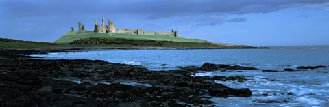 Framed Dunstanburgh Castle at the coast, Northumberland, England Print