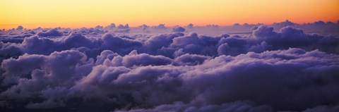 Framed Sunset above the clouds Print