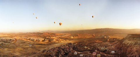 Framed Hot air balloons over a village in Cappadocia, Central Anatolia Region, Turkey Print