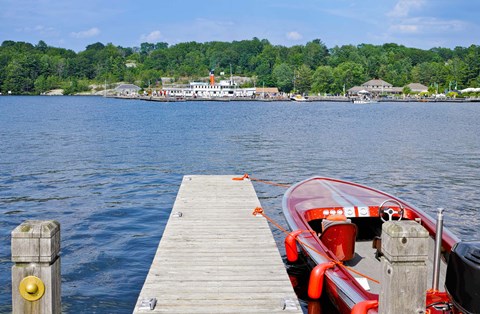 Framed Motorboat moored at a pier, Gravenhurst Bay, Gravenhurst, Ontario, Canada Print