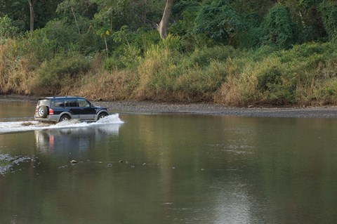 Framed Sports utility vehicle crossing a river, Ora River, Playa Carrillo, Guanacaste, Costa Rica Print