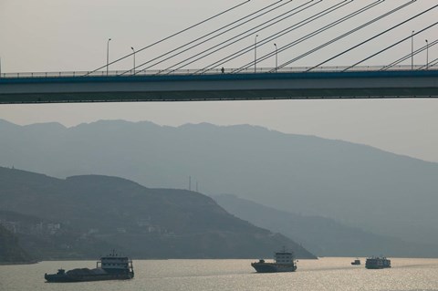 Framed Container ships passing a newly constructed bridge on the Yangtze River, Wanzhou, Chongqing Province, China Print