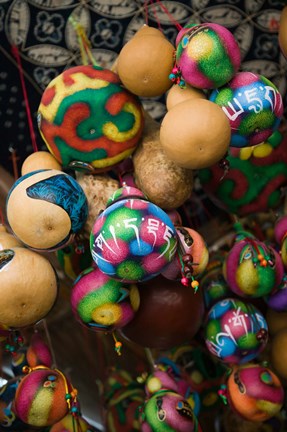 Framed Painted gourds for sale in a street market, Old Town, Lijiang, Yunnan Province, China Print