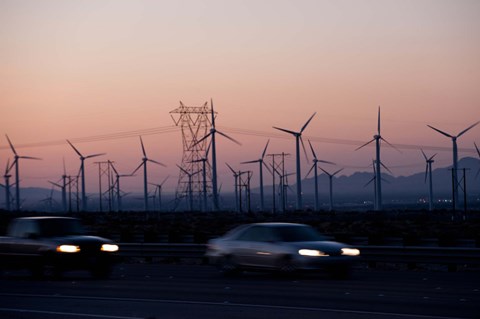 Framed Cars moving on road with wind turbines in background at dusk, Palm Springs, Riverside County, California, USA Print