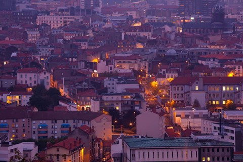 Framed Aerial view of building lit up at dusk viewed from Parc de Montjuzet, Clermont-Ferrand, Auvergne, Puy-de-Dome, France Print