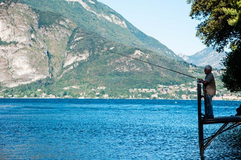 Framed Man Fishing from Dock on Edge of Lake Como, Varenna, Lombardy, Italy Print