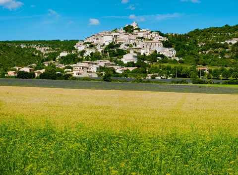Framed Farm with a town in the background, Simiane-La-Rotonde, Alpes-de-Haute-Provence, Provence-Alpes-Cote d&#39;Azur, France Print