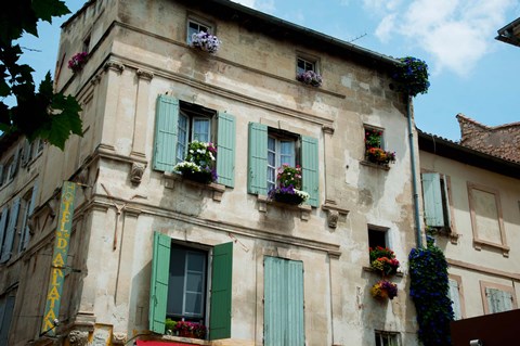 Framed View of an old building with flower pots on each window, Rue Des Arenes, Arles, Provence-Alpes-Cote d&#39;Azur, France Print