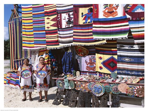 Framed Two female vendors dressed in Mayan costumes displaying products Print