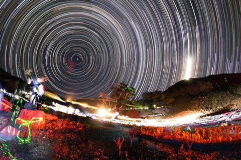 Framed Astronomers observe polar star trails above a mountain in Iran Print