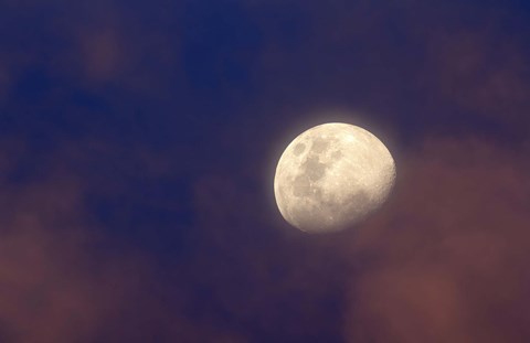 Framed moon between colorful clouds at sunset Print