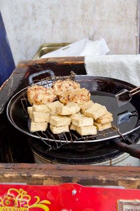 Framed China, Shanghai. Village of Zhujiajiao. Homemade snacks cooked in wok. Print