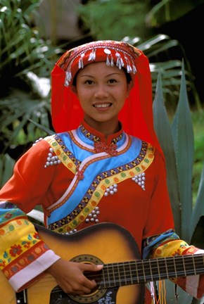 Framed Ethnic Dancer Playing Guitar, Kunming, Yunnan Province, China Print
