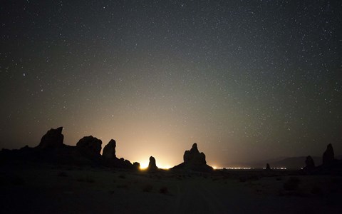 Framed Large tufa formations at Trona Pinnacles against a backdrop of stars Print