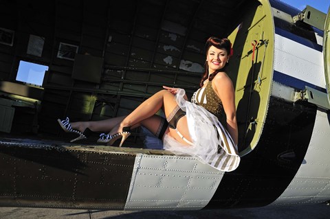 Framed Sexy 1940&#39;s style pin-up girl sitting inside of a C-47 Skytrain aircraft Print