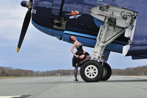 Framed 1940&#39;s style pin-up girl resting on the wheel of a TBM Avenger Print