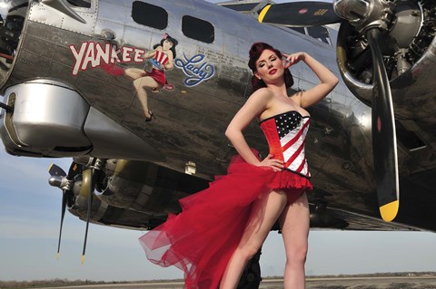 Framed Beautiful 1940&#39;s style pin-up girl standing under a B-17 bomber Print