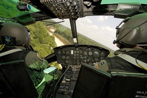 Framed Two instructor pilots practice low flying operations in a UH-1H Huey helicopter Print