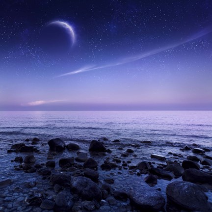 Framed Moon rising over rocky seaside against starry sky Print
