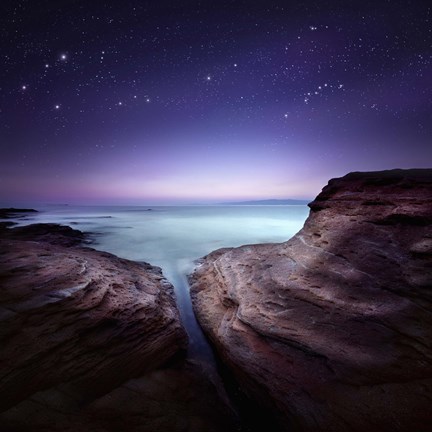 Framed Two large rocks in a sea, against starry sky Print