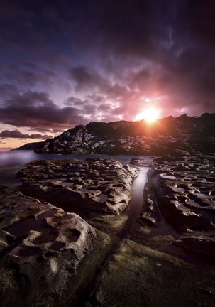 Framed Rocky shore and tranquil sea against cloudy sky at sunset, Sardinia, Italy Print