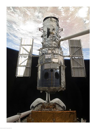 Framed Space Shuttle Atlantis&#39; arm lifts the Hubble Space Telescope from the cargo bay Print