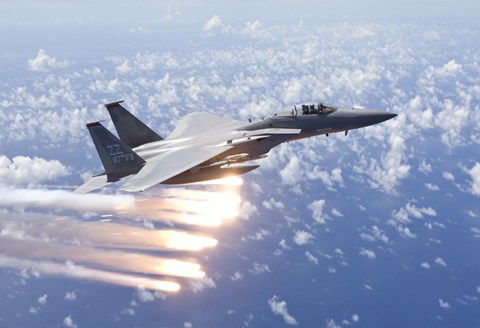 Framed F-15 Eagle Releases Flares over the Pacific Ocean Print