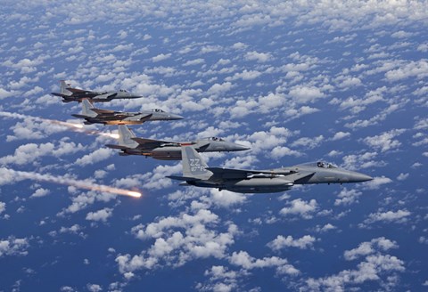 Framed Four F-15 Eagles fly in Formation Over the Pacific Ocean Print