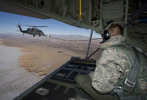 Framed Loadmaster on an HC-130 Watches a HH-60G Pave Hawk Refuel Print