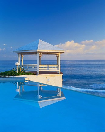 Framed Gazebo reflecting on pool with sea in background, Long Island, Bahamas Print