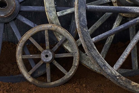 Framed Rustic wagon wheels on movie set, Cuba Print
