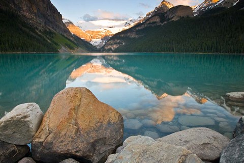 Framed Rocky Mountains and boulders reflected in Lake Louise, Banff National Park, Alberta, Canada Print