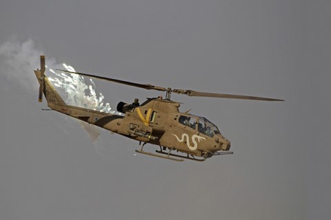 Framed AH-1S Tzefa of the Israeli Air Force dispenses flares Print