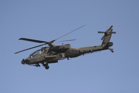 Framed AH-64 Apache in flight over the Baghdad Hotel in central Baghdad, Iraq Print