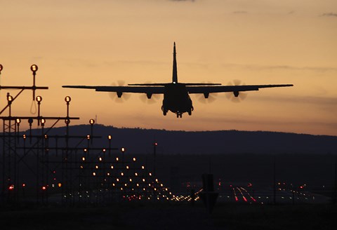 Framed C-130J Super Hercules Landing at Ramstein Air Base, Germany, at Dusk Print