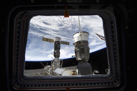 Framed Two Russian Spacecraft Docked with the International Space Station, as seen from Space Shuttle Discovery&#39;s Flight Deck Window Print