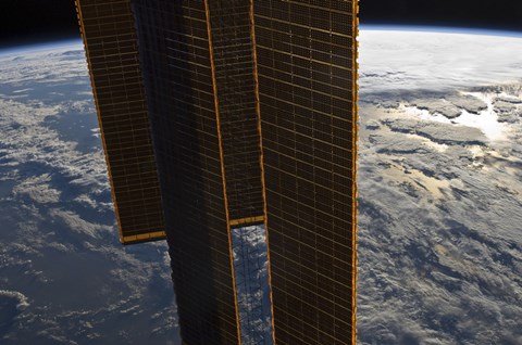 Framed Solar Panels of the International Space Station Backdropped by a Blue and White Earth Print