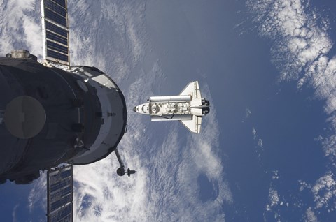 Framed Space Shuttle Atlantis and a Russian Spacecraft backdropped by a Blue and White Earth Print