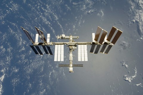 Framed International Space Station Backdropped against Earth Print